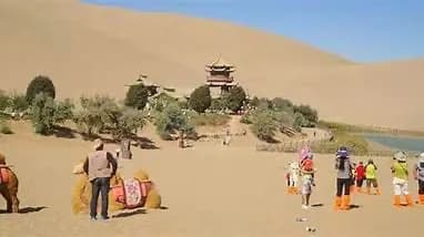 International media visits Cresent Moon Lake, Mingsha Mountain Scenic area in Dunhuang, China